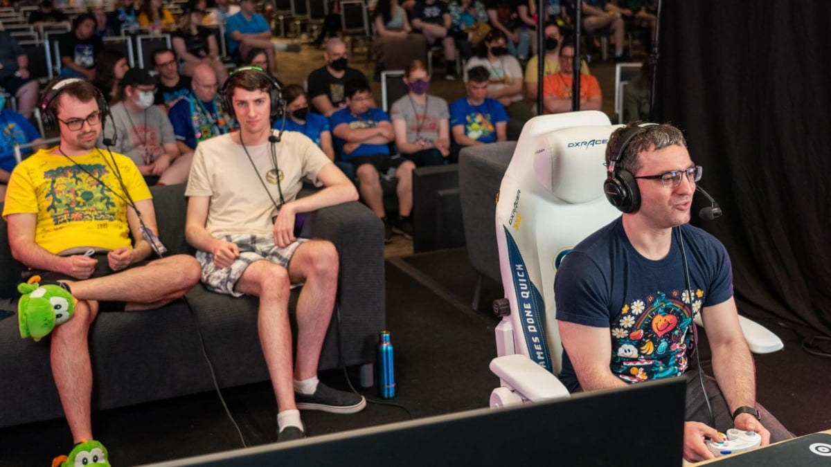 Gamers speedrunning while an audience watches in the Summer Games Done Quick 2024 event