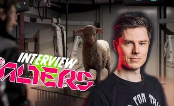 Jan looking at a Sheep in The Alters with Rafał Włosek's headshot from 11Bit studios