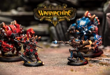 Warmachine miniatures set to battle, with Warmachine title in the middle, and the Steamforged Games logo in the bottom right
